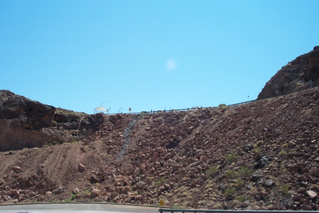 While standing at the second vista. I turned around and there were people at yet a third vista higher up. I didn't stop there though. It was over 100F out here and my cats were waiting in the car. I couldn't leave the car idleing for very long or it would over heat. It was no problem on the road, but with those kind of temperatures, the radiator needs airflow to disippate enough heat.