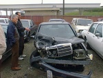 The nearest guy is the owner of the tow yard. The guy on the other side of him is the guy I hit.